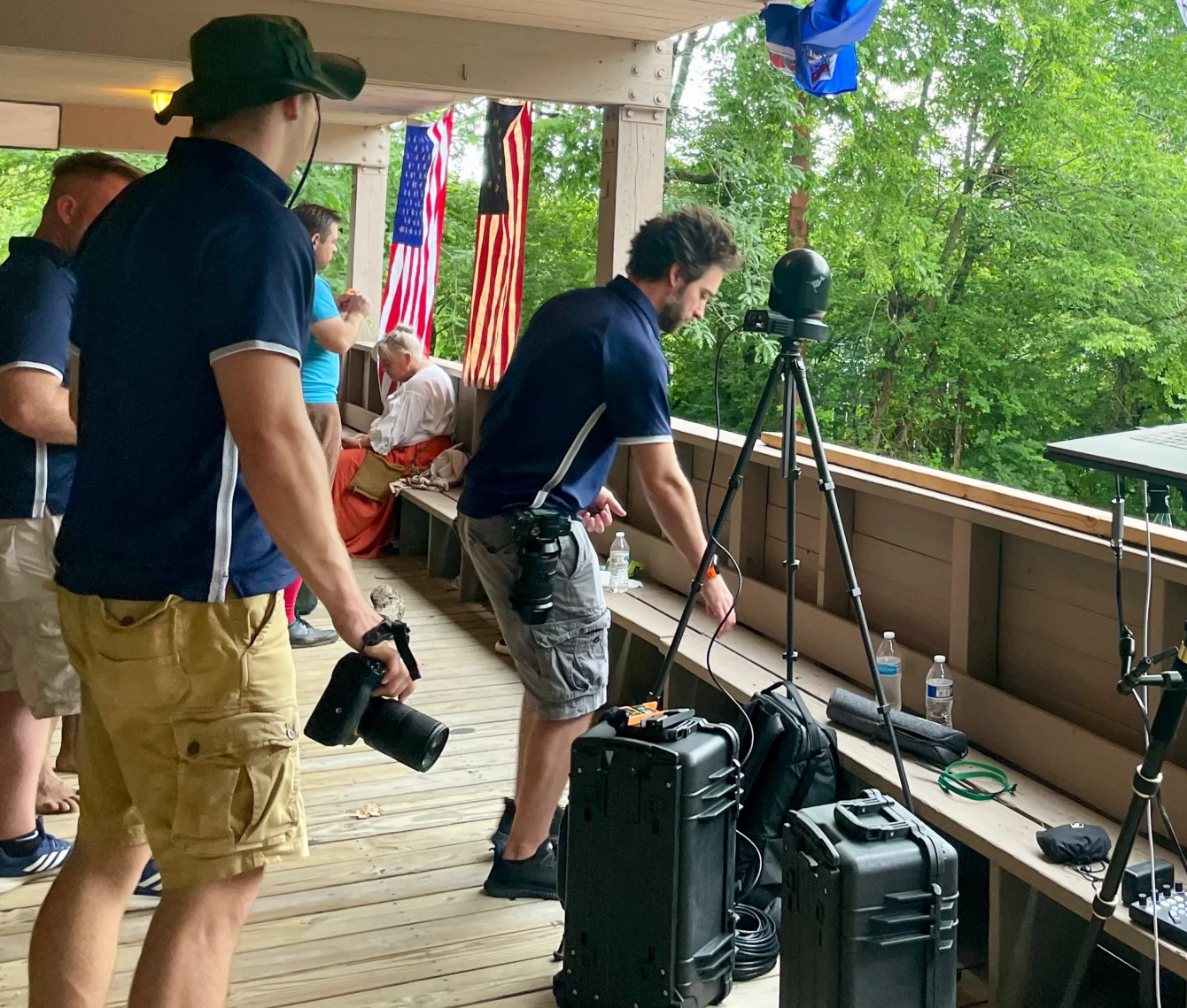 A group of people standing around with luggage.